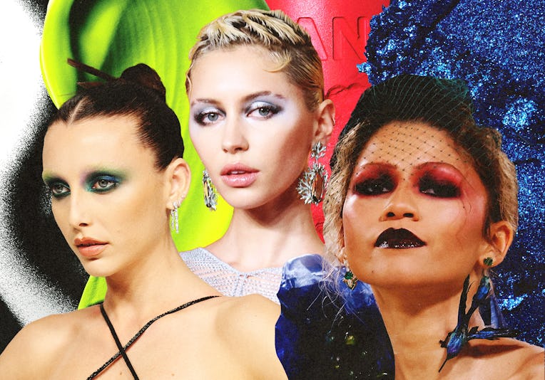 Three women with dramatic makeup and hairstyles against vibrant green, red, and blue backgrounds.