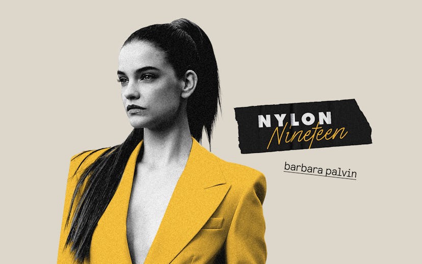 Barbara Palvin in a yellow blazer with a belt around the waist while sporting a high ponytail 