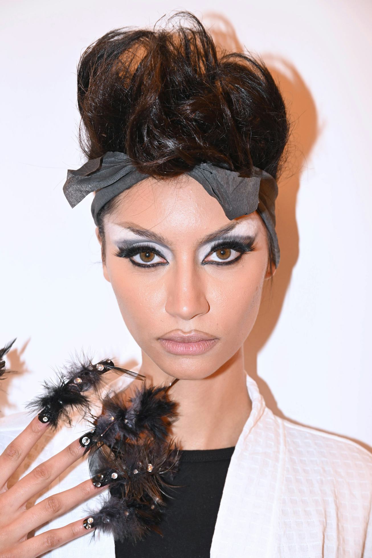 NEW YORK, NEW YORK - FEBRUARY 10: A model prepares backstage for TRESemme X Luar on February 10, 202...