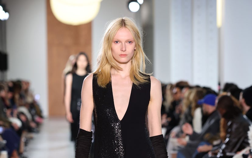 NEW YORK, NEW YORK - FEBRUARY 11: Alex Consani walks the runway during the Michael Kors Collection F...