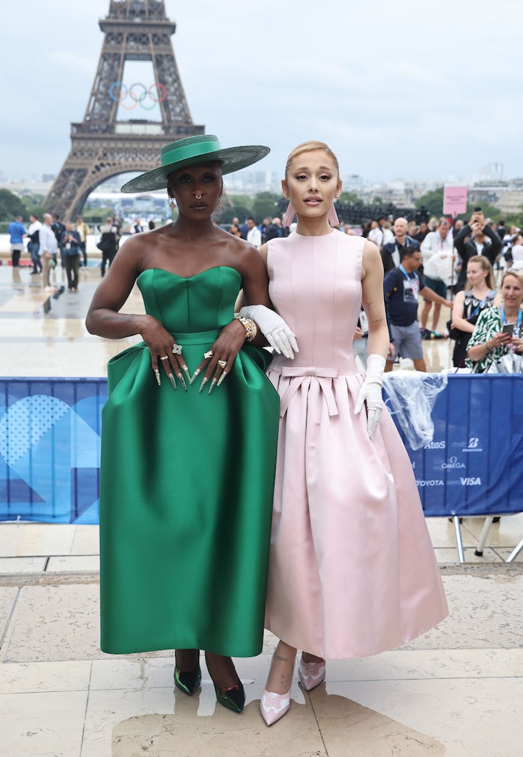 US actor and singer Cynthia Erivo (L) and US snger Ariana Grande (R) pose for a photo on the red car...